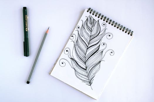 Artistic feather sketch with pen and pencil on sketchpad, showcasing intricate details.